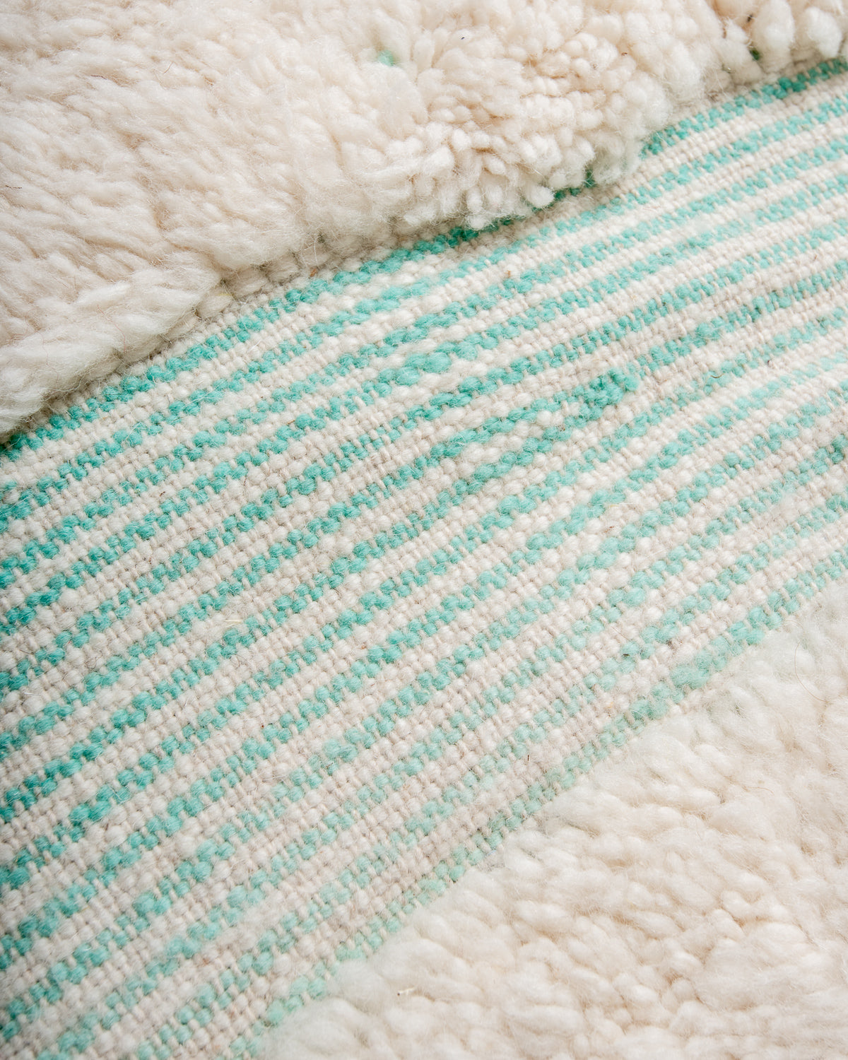 Modern, designer, handcrafted Berber rug from Morocco. Beniourain carpet with beautiful colours and patterns and fluffy wool texture.